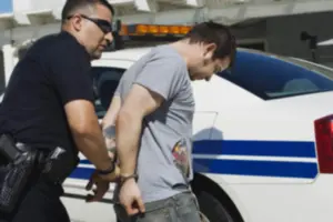 police officer arresting a man