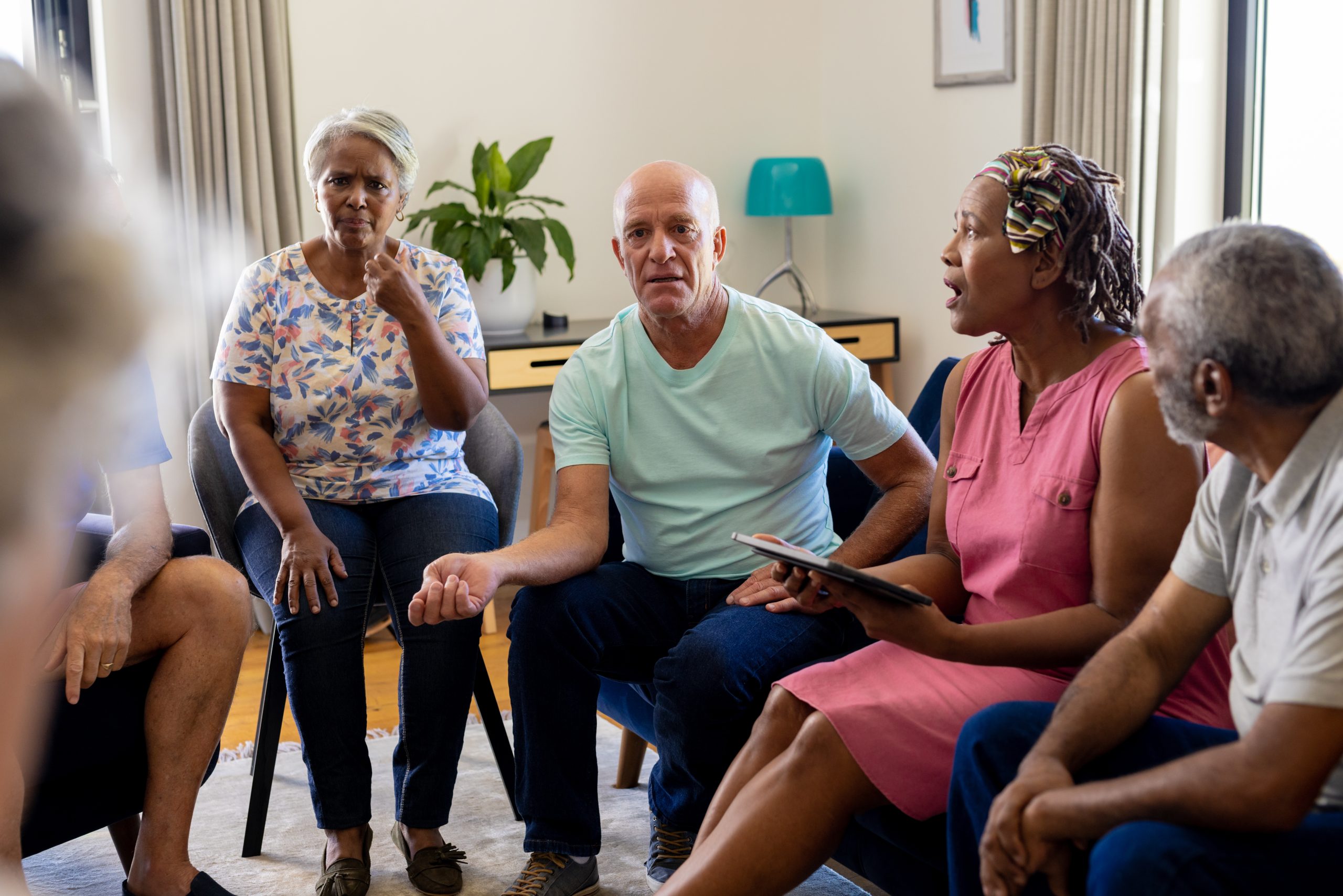 a group of people talk in a circle
