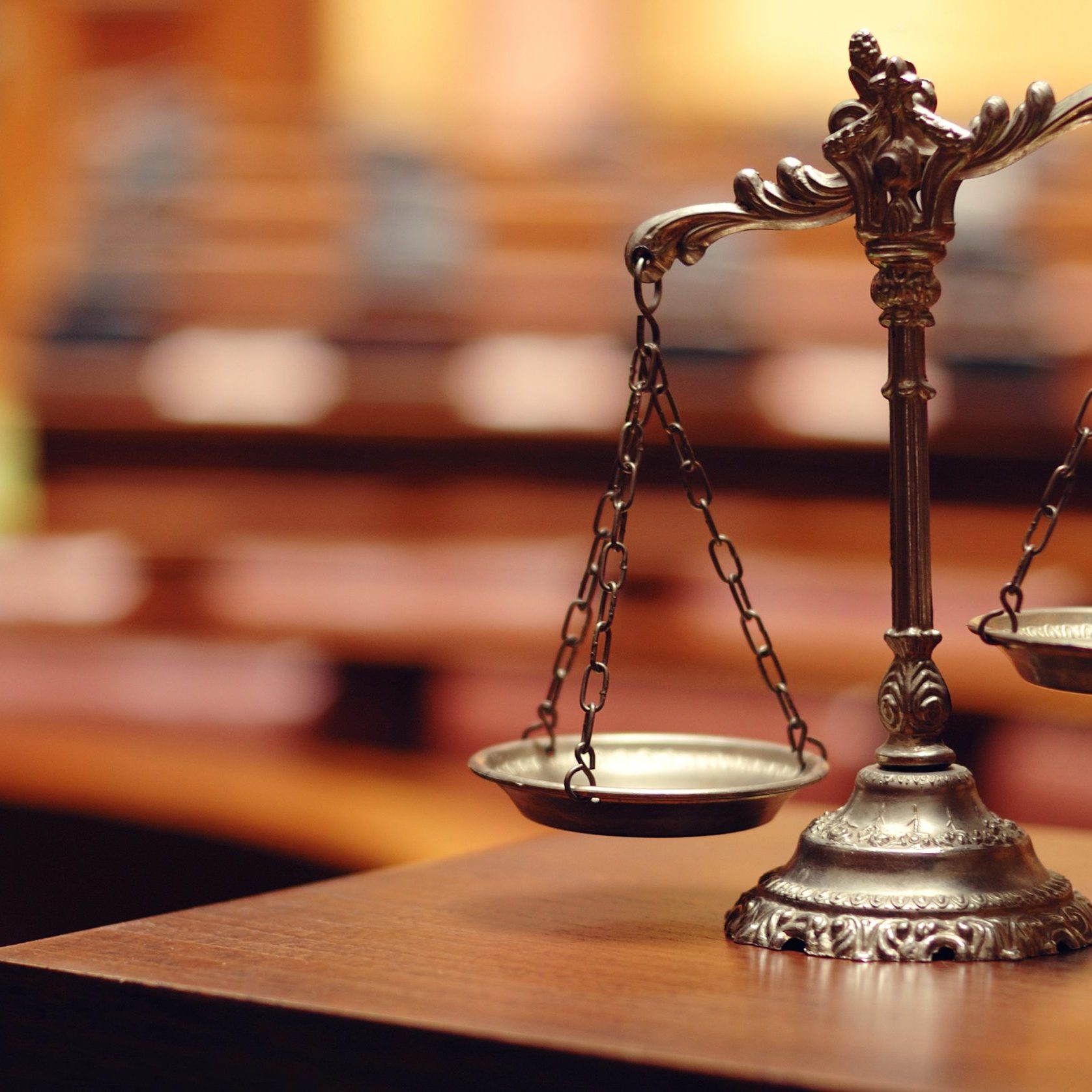 Decorative Scales of Justice in the Courtroom Symbol of law and justice in the empty courtroom, law and justice concept.